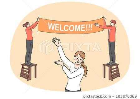 Happy people hanging welcome banner 103876069