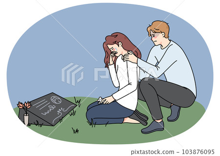 Sad couple crying at pet gravestone Sad couple crying at pet gravestone 103876095