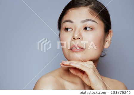 young asian woman on blue young asian woman on blue 103876245