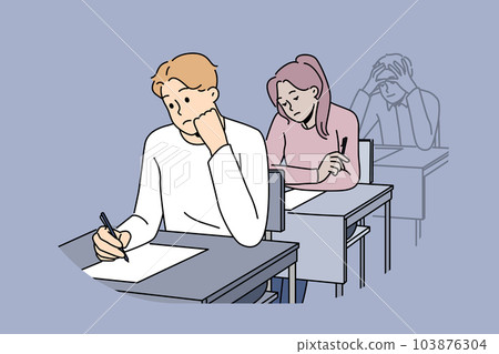 Distressed students write on exam in school Distressed students write on exam in school 103876304