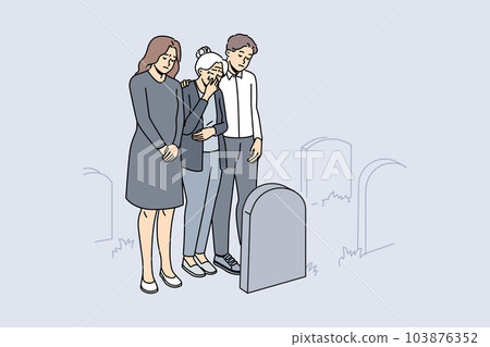 Desperate people cry at grave on cemetery  103876352