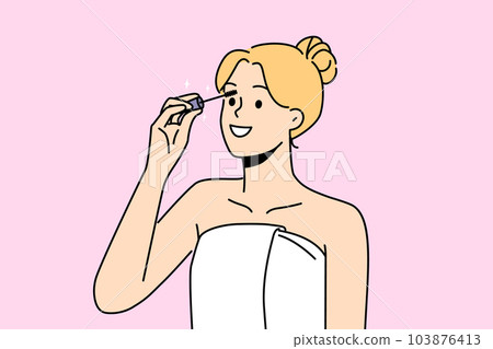 Smiling woman painting lashes with mascara  103876413