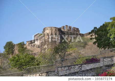 Exteriors and the fortification wall of Moti Doongri Fort with a palace perched right on top, a replica of a Scottish Castle, once the royal home of Maharaja Sawai Man Singh, Jaipur, Rajasthan, India Exteriors and the fortification wall of Moti Doongri Fort with a palace perched right on top, a replica of a Scottish Castle, once the royal home of Maharaja Sawai Man Singh, Jaipur, Rajasthan, India 103877274