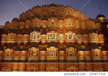 Exteriors of the Hawa Mahal or Wind Palace, built from red and pink sandstone. It is akin to a honeycomb with its 953 small windows called Jharokhas decorated with intricate latticework, Jaipur, 103877356