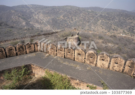Exteriors and fortification wall of Jaigarh Fort situated on Cheel ka Teela or Hill of Eagles of the Aravalli range, it overlooks the Amer Fort and the Maota Lake, near Amer Jaipur, Rajasthan, India Exteriors and fortification wall of Jaigarh Fort situated on Cheel ka Teela or Hill of Eagles of the Aravalli range, it overlooks the Amer Fort and the Maota Lake, near Amer Jaipur, Rajasthan, India 103877369