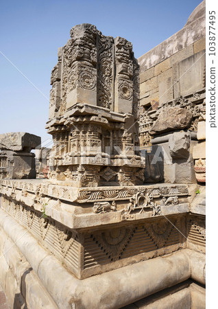 Carved stone idols on the outer wall of The Harshat Mata Temple, a Hindu temple dedicated to a goddess Harshat Mata, Abhaneri, Rajasthan, India 103877495