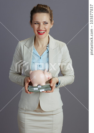 smiling business owner woman in light business suit 103877837