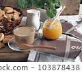 Food background.Healthy homemade food.A cup of tea with milk and homemade butter cookies. 103878438