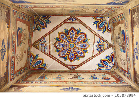 Colourful paintings on the ceiling of an old chhatri (cenotaph), Seth Anantram Podar and family ki smarak rupi chhatri, located in Ramgarh, Shekhawati, Rajasthan, India 103878994