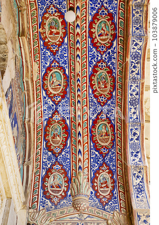 Colourful mythological paintings on the ceiling of an entrance gate of Khemka Balaji Mandir, located in Ramgarh, Shekhawati, Rajasthan, India 103879006