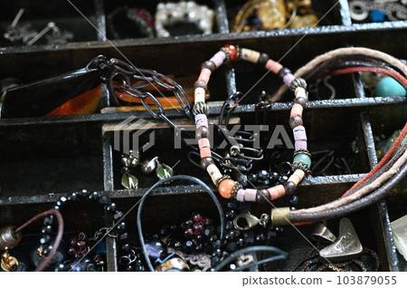 Antique accessories found in an old jewelry box 103879055