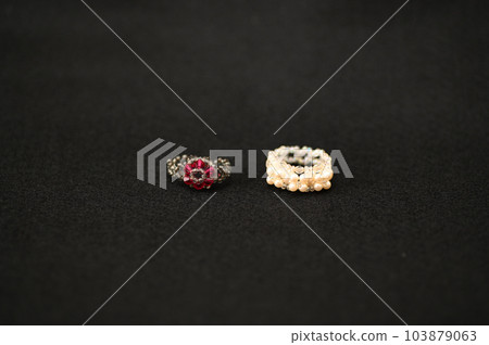 Antique accessories found in an old jewelry box 103879063