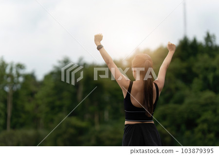 Healthy Asian woman is warm up before jogging outdoor. Fitness girl running. Female exercising at outdoor park Healthy Asian woman is warm up before jogging outdoor. Fitness girl running. Female exercising at outdoor park 103879395