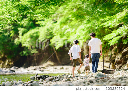 family playing in the river family playing in the river 103880524