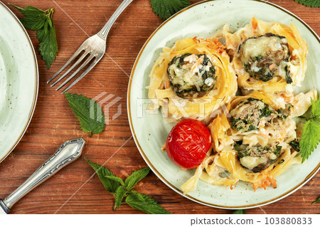 Nest of macaroni with meatballs, keto dish. 103880833