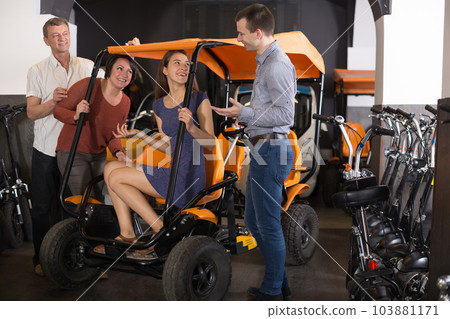 family of tourists of different generations hire bike carriage family of tourists of different generations hire bike carriage 103881171