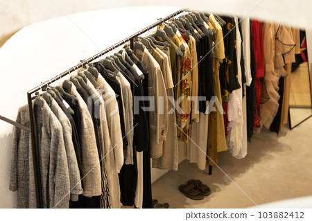 Women's casual demi - season clothes on a hanger in the shop Women's casual demi - season clothes on a hanger in the shop 103882412