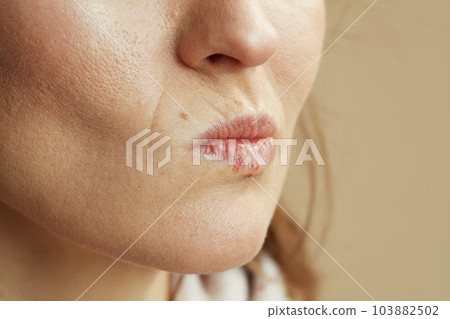 Closeup on woman isolated on beige background 103882502