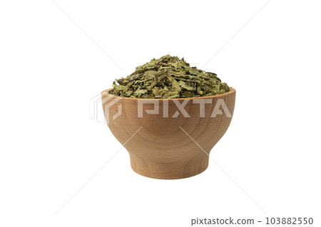 Dried leaves o Lemon verbena in latin Aloysia citrodora in wooden bowl isolated on white background. Medicinal herb. Dried leaves o Lemon verbena in latin Aloysia citrodora in wooden bowl isolated on white background. Medicinal herb. 103882550
