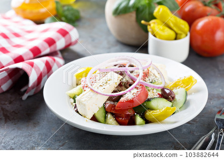 Greek salad with fresh vegetables and feta 103882644