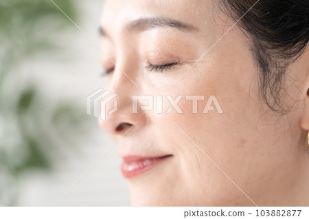 Middle-aged woman around the eyes 103882877