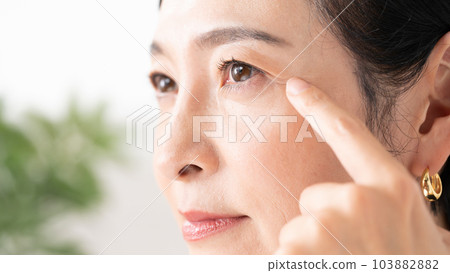 Middle-aged woman around the eyes 103882882
