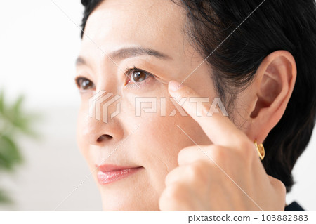 Middle-aged woman around the eyes 103882883