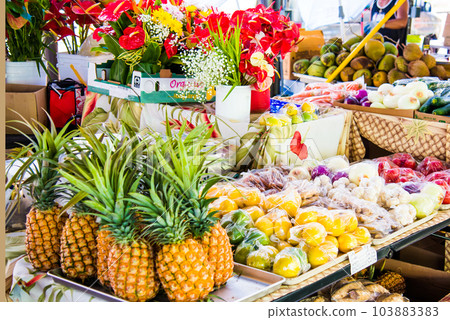 Fruits and flowers at the Hilo Farmers Market on the Big Island of Hawaii Fruits and flowers at the Hilo Farmers Market on the Big Island of Hawaii 103883383