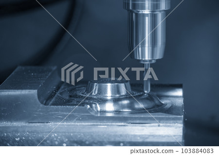 The CNC milling machine cutting injection mold part by solid ball end mill tool in the light blue scene. 103884083