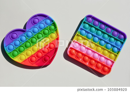 Simple Dimple. Antistress Pop it Toy. Sensory Fidget Isolated on White Background. New Trendy Colorful Silicone Toy for child. Simple Dimple. Antistress Pop it Toy. Sensory Fidget Isolated on White Background. New Trendy Colorful Silicone Toy for child. 103884920