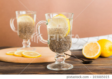 Healthy breakfast or morning with chia seeds and lemon on table background, vegetarian food, diet and health concept. Chia pudding with lemon Healthy breakfast or morning with chia seeds and lemon on table background, vegetarian food, diet and health concept. Chia pudding with lemon 103885015