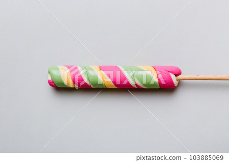 Colorful candies, lollypop on the colorful background, multicolored minimal style top view 103885069