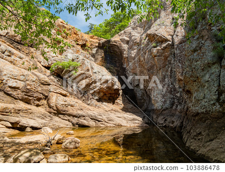 Sunny view of the Post Oak Waterfall landscape of Wichita Mountains Sunny view of the Post Oak Waterfall landscape of Wichita Mountains 103886478