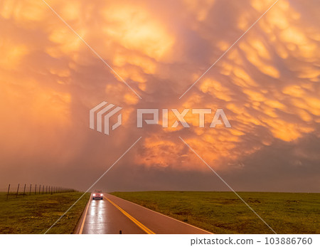 Sunset view of beautiful clouds and lighting in Wichita Mountains National Wildlife Refuge 103886760