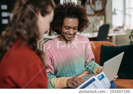 Young colleagues working together in startup company. 103887199