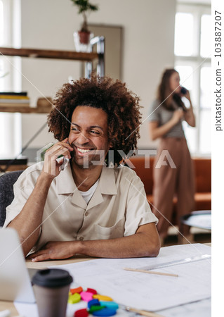 Young colleagues working together in startup company. 103887207