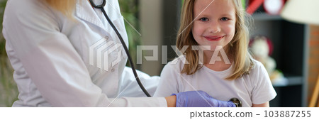 Cheerful little child at doctor pediatrician appointment 103887255