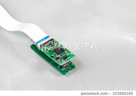 tiny circuit board, IOT device, micro controller or nano computer circuit board running on wire connection with red lamp status isolate on white background.  103888189