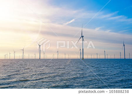 Offshore Windmill farm. windmills isolated at sea on a beautiful bright day Netherlands 103888238