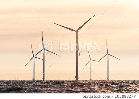 Offshore Windmill farm. windmills isolated at sea on a beautiful bright day Netherlands 103888277