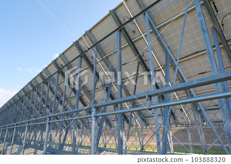 Behind the solar panel 103888320