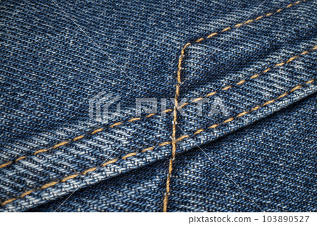 closeup of stitching on a blue denim jacket closeup of stitching on a blue denim jacket 103890527