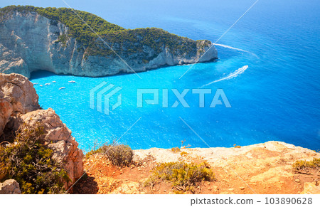 Navagio bay or Shipwreck beach on a sunny summer day, Greece Navagio bay or Shipwreck beach on a sunny summer day, Greece 103890628