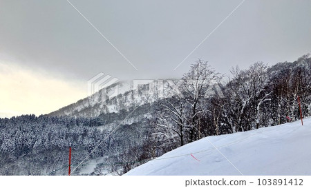 Snow mountain and dark sky at Niseko Grand Hirafu ski resort 103891412