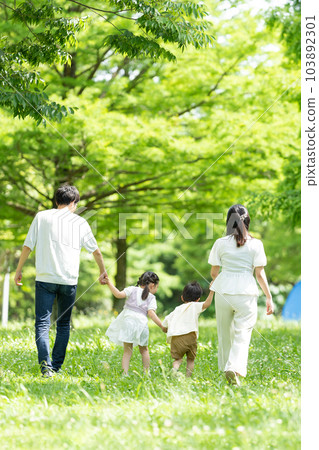 A family walking hand in hand 103892301