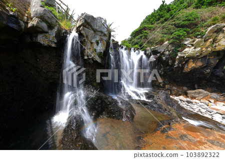 This is a beautiful view of Sojeongbang Waterfall in Seogwipo, Jeju Island. This is a beautiful view of Sojeongbang Waterfall in Seogwipo, Jeju Island. 103892322