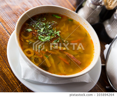 Russian cuisine - solyanka soup with various ingredients Russian cuisine - solyanka soup with various ingredients 103894264