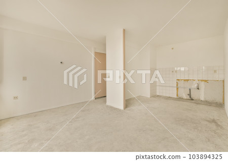 an empty room with white walls and no one wall in the photo is taken out to show how it's done 103894325