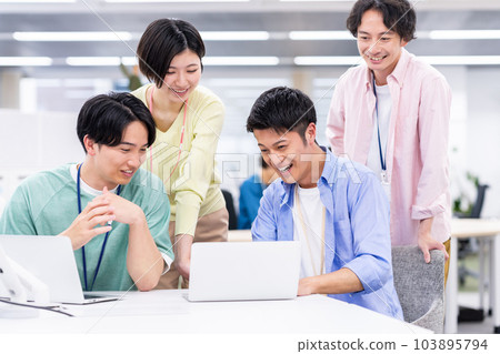 Staff having a meeting in the office 103895794