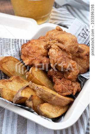 Fried chicken, potatoes and beer Vertical position 103896198